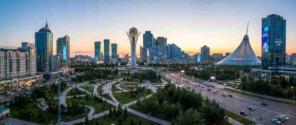 City skyline of Kazakhstan showcasing modern architecture and green parks.