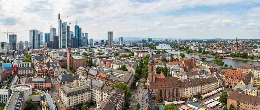 Panoramic view of diverse European cityscapes showing modern and traditional architecture.