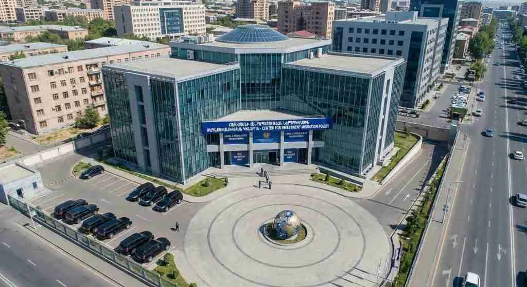 Aerial view of a modern government building surrounded by greenery.